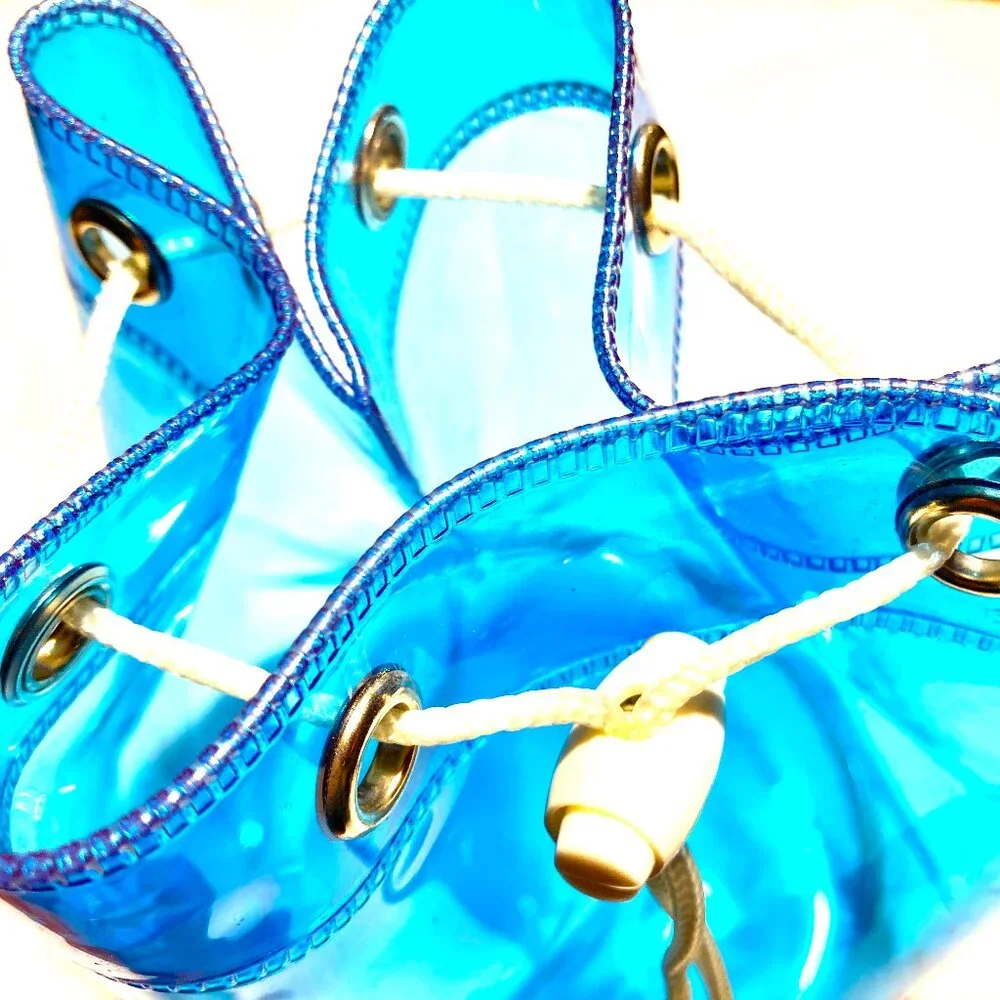CoverGirl Plastic Duffle Bag with rope closure